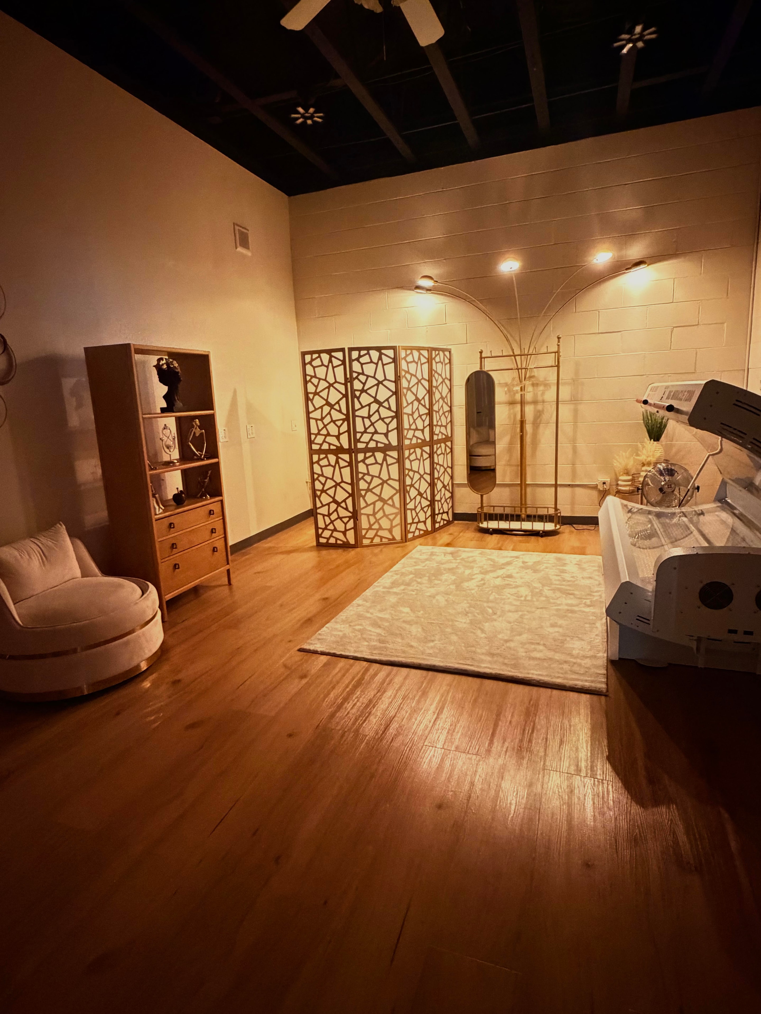PilatesLand studio interior with reformers and PilatesLand logo